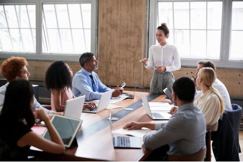 Women presenting in room