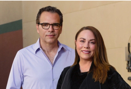 Man and woman smiling at camera