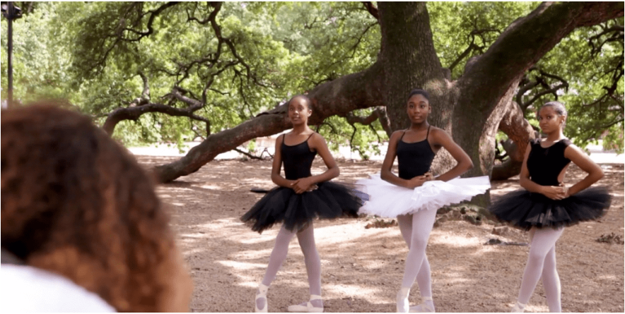 Ballet dancers in front of a tree