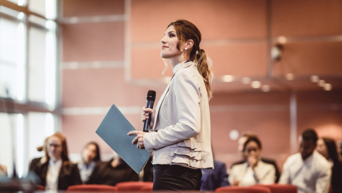 Business People Listening to the Speaker at a Conference