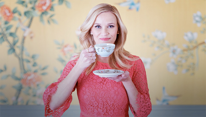 Reese Witherspoon drinking from a tea cup