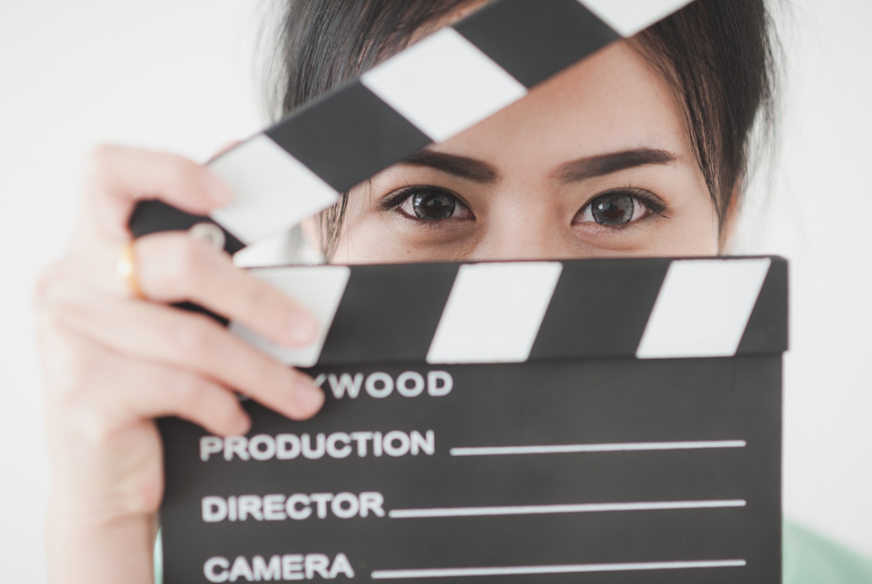 Woman with a production slate